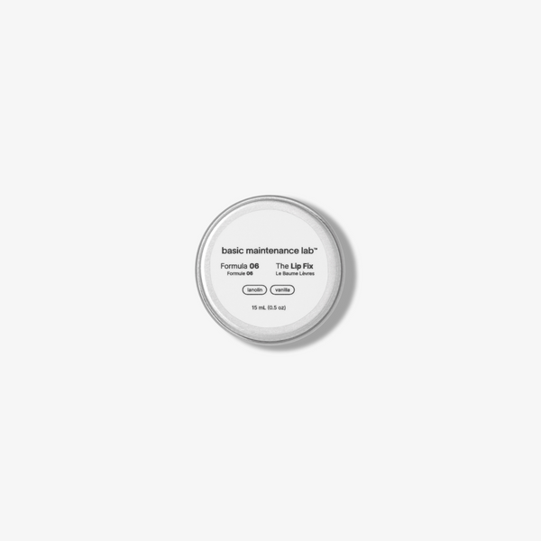 Basic Maintenance Formula 06 The Lip Fix shown in a round tin with a white label